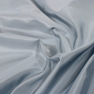 close-up of light blue colored silk taffeta fabric, detailing its ribbed-like face and subtle shine