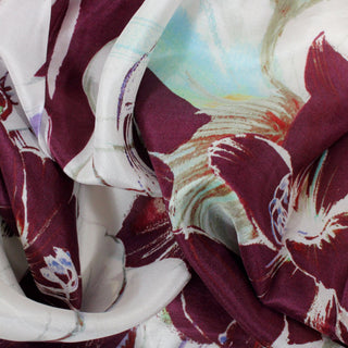 Close-up of a silk mikado twill weave fabric with a multicolor floral pattern