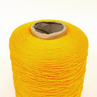 close-up of a large cone of marigold colored orange fine-gauge worsted yarn