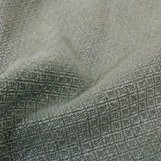 close-up of matcha colored upholstery fabric, detailing the woven diamond face