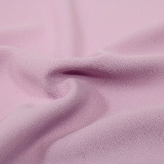 close-up of a textural matte crepe fabric, detailing its rough face