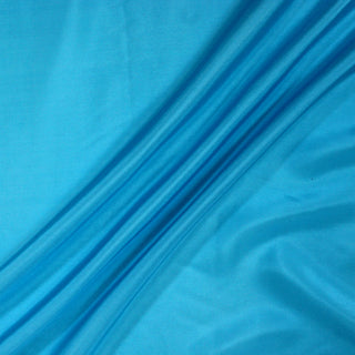 three diagonal lines draped of a mediterranean blue silk habotai lining fabric