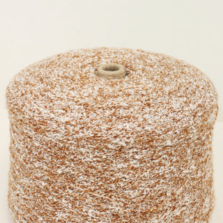 close-up of a large cone of fine, curly yarn in cinnamon and white color