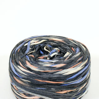 close-up of a ball of black and multicolored ribbon yarn