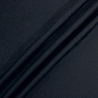 navy jacquard fabric rumpled to show texture and drape