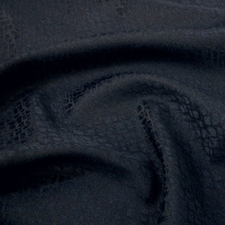 close-up of navy jacquard fabric showing detailed look at weave structure and surface texture