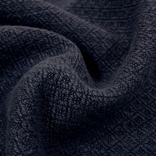close-up of navy diamond upholstery fabric, detailing the woven in pattern