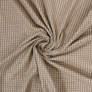 swirl of oatmeal colored brown checked fabric