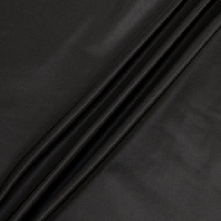 black silk faille fabric arranged with three diagonal lines to show its structured hand and subtle shine