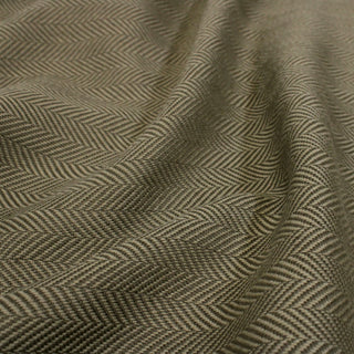 close-up of herringbone suiting fabric, detailing the weave structure