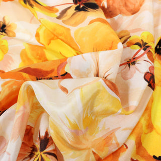 close-up of yellow and orange floral silk chiffon fabric