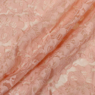 three diagonal lines draped of a pink stretch lace floral mesh fabric, demonstrating its sheer nature, drapeability, and lightweight hand