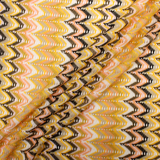 three diagonal lines draped of a peach and brown chevron novelty knit fabric