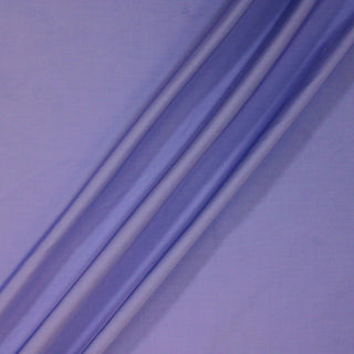 ripple of a periwinkle colored poplin fabric demonstrating the drape and hand