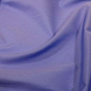 close-up of a periwinkle colored poplin fabric demonstrating the hand and weave