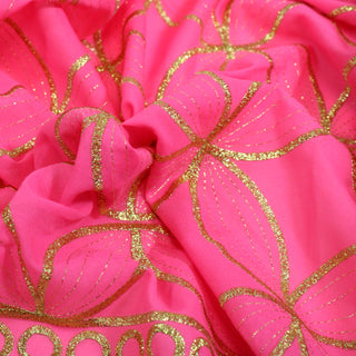 close-up of pink and gold voile pattern fabric
