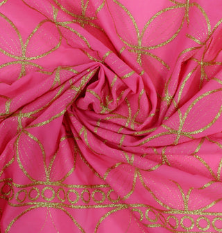 swirl of pink voile fabric with gold lurex design woven throughout