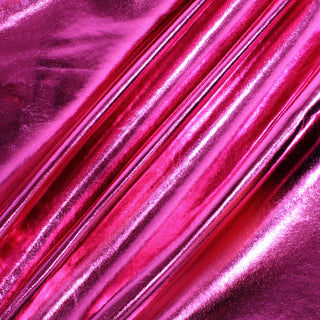 three diagonal lines draped of hot pink metallic vinyl pleather fabric demonstrating its metallic shine and subtle structured hand