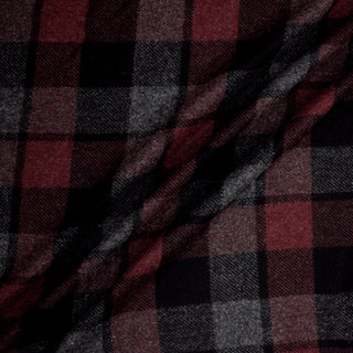 ripple of plaid flannel fabric in colors oxblood, black and grey