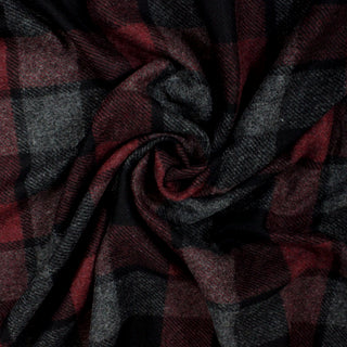 swirl of oxblood, grey, and black plaid flannel fabric