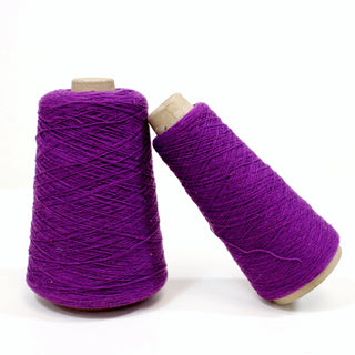 two cones of purple woold fine-gauge yarn