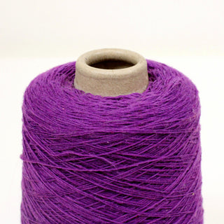 close-up of a cone of purple wool fine-gauge yarn