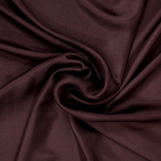 swirl of raisin colored silk mikado fabric