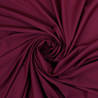 swirl of raspberry color tricot knit fabric