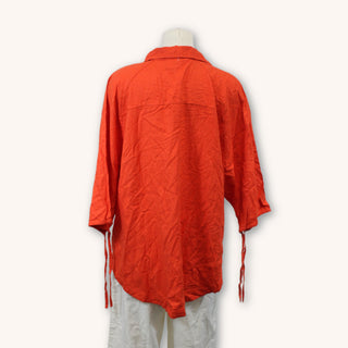 back of a red-orange button up shirt