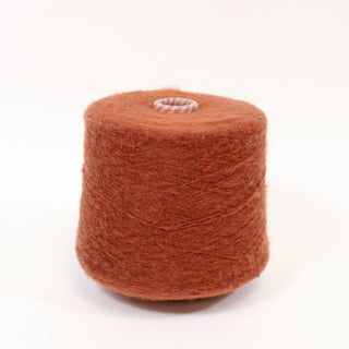 large cone of fine-gauge redwood colored fuzzy yarn, best suited to machine knitting use