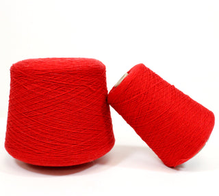 two cones of red wool ultra-fine gauge yarn