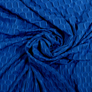 swirl of royal blue colored textured knit fabric