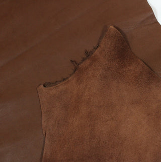 front and back of a saddle brown colored lambskin leatherhide, revealing the soft sueded backside