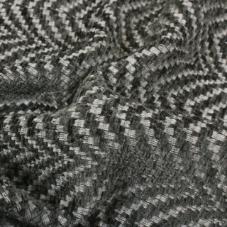 close-up of sage green and ivory colored scallop upholstery fabric, detailing the weave structure and plush green fibers
