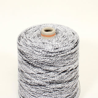 close-up of a salt&pepper slub yarn yarn cone