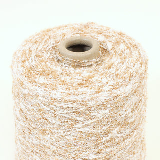 close-up of a cone of fine-gauge curly textural yarn in a sandy color palette of white and brown