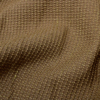 close-up of sandy brown colored woven upholstery fabric, detailing the textural face and woven-in grid pattern