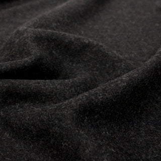 close-up of felted fabric in a shadow-grey color, showing texture of felting