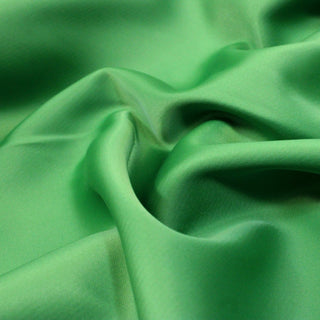 close-up of shamrock green poly duchess satin, showing weave and hand
