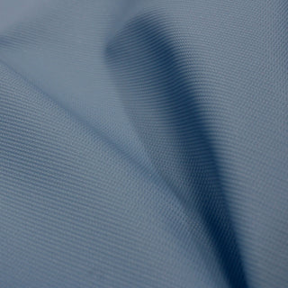 close-up of sky blue colored textured polyurethane vinyl, detailing the embossed faux twill weave pattern on its face
