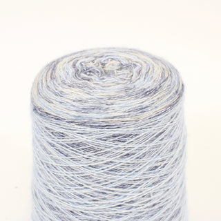 close-up of a cone of multicolor worsted-twist yarn of a fine-gauge