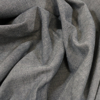 close-up of a slate grey chambray fabric, detailing its weave