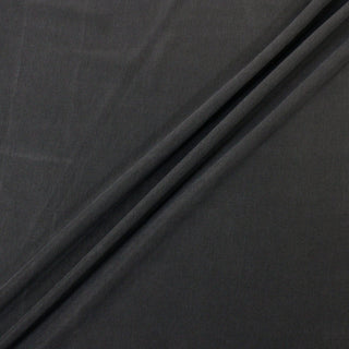 three diagonal lines draped of a dark slate colored jersey fabric