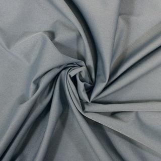 swirl of slate blue colored twill fabric, demonstrating its stiff drape