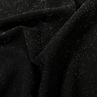 close-up of black knit fabric flecked with silver lurex threads