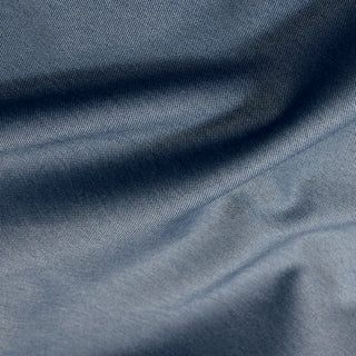 close-up of a steel blue twill fabric, detailing its twill weave structure and two-toned quality