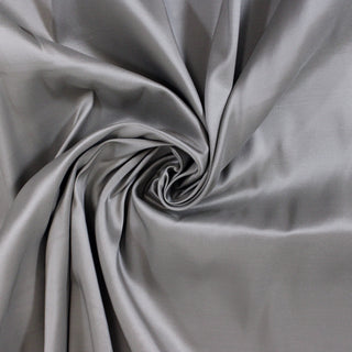 swirl of sterling silver colored silk taffeta fabric