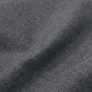 up close of stormy grey brushed tweed upholstery fabric to show weave structure