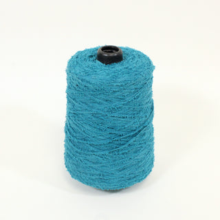 small cone of teal colored eyelash yarn