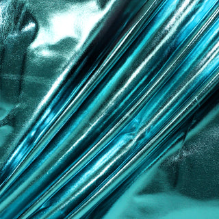 three diagonal lines draped of a teal colored metallic vinyl pleather fabric demonstrating its iridescence and subtle structural drape